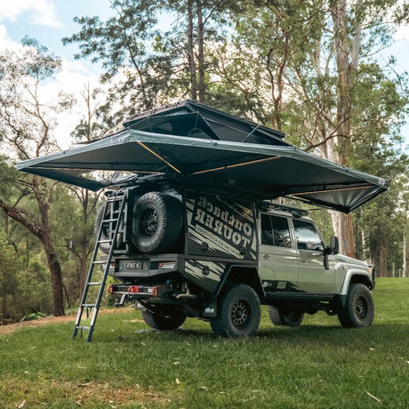 Outback Tourer Drivers Side 270 Plus with D Zipper Awning rear right installed view with a ladder on a 79 Landcruiser.
