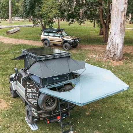 Outback Tourer Drivers Side 270 Plus with D Zipper Awning top back view with rooftop tent and solar panels.