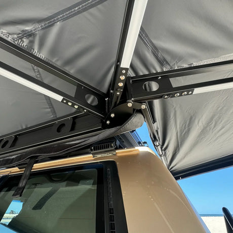 Outback Tourer Passenger Side 270 Awning frame corner hinge with black arms and integrated LED lights.
