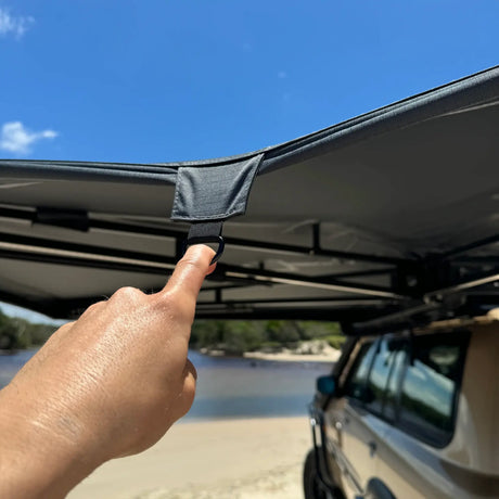 Outback Tourer Passenger Side 270 Awning tie down hook on the awning edge for rain.