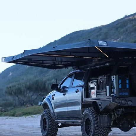 Outback Tourer Passenger Side 270 Plus Awning side installed on a ute canopy beside the beach dunes.