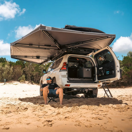 Outback Tourer Passenger Side 270 Plus Awning rear underside view over an open rear prado door at the beach.