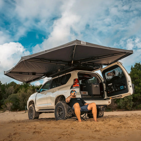 Outback Tourer Passenger Side 270 Plus Awning underside corner view over a prado on the beach.