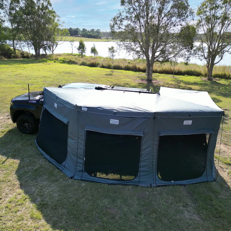 Outback Tourer Passenger Side 270 Plus Full Wall Kit top corner view beside a lakeside campsite.