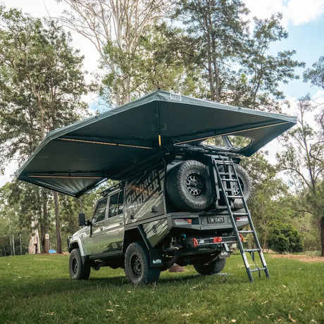 Outback Tourer Passenger Side 270 Plus with D Zipper Awning rear view with ladder and underside frame.
