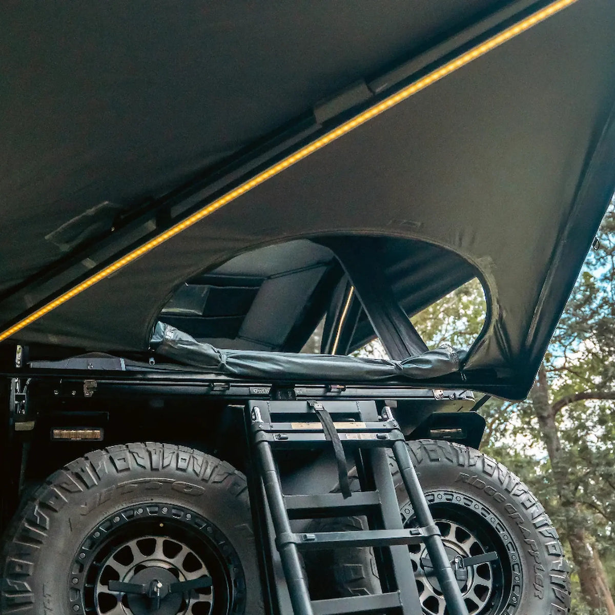 Outback Tourer Passenger Side 270 Plus with D Zipper Awning close up of D-shaped opening and rolled canvas.