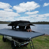 Outback Tourer Passenger Side 270 Plus with D Zipper Awning top view beside a lake.
