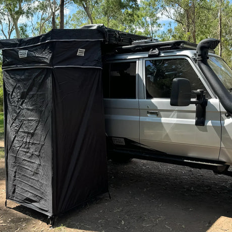 Outback Tourer Shower Awning front left view mounted on a vehicle.