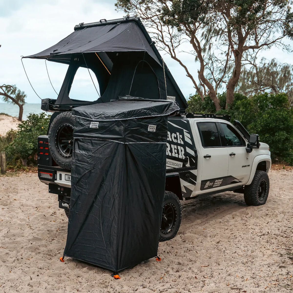 Outback Tourer Shower Awning right side view with a rooftop tent opened.