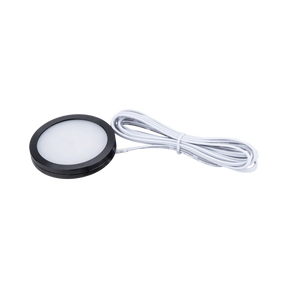Rekcharge 12V black cool white LED downlight in an angled view with its coiled white lead.
