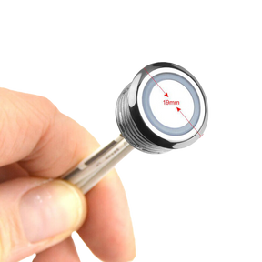 Rekcharge 12V LED touch dimmer switch held in a hand with its 19mm face diameter marked.