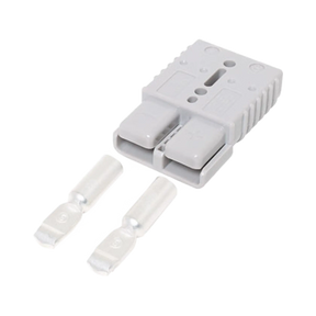 Rekcharge grey 175A Anderson plug housing with two loose metal contacts laid out in front.