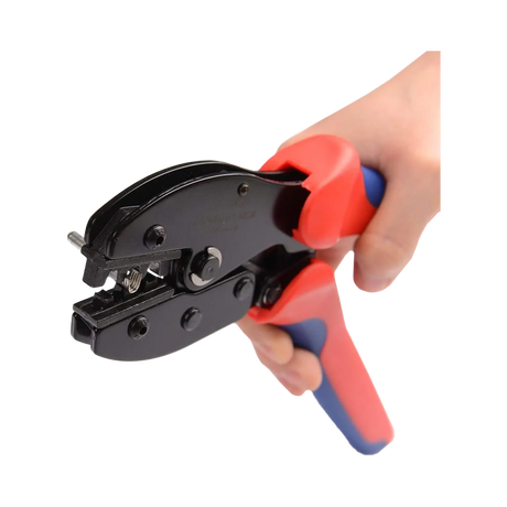 Rekcharge MC4 crimping tool held in a hand with the handles apart and crimping jaws open.