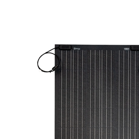 Roam Gear 100W 12V Black ETFE flexible solar panel close-up of corner junction box and cable.