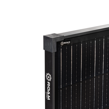 Roam Gear 200W 12V black glass solar panel corner close up with a cap, side frame logo and cell detail.