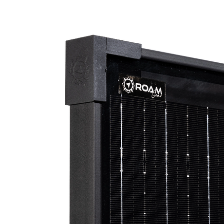 Roam Gear 200W 12V slimline black glass solar panel upper corner close up with corner cap and top logo.