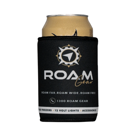 Roam Gear black stubby cooler front view around a can, with the white and gold logo facing forward.